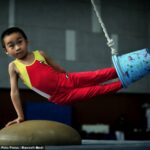 Kinijoje vaikai nuo 4 metų alinančiomis treniruotėmis ruošiami Olimpiadai (foto)