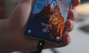 a hand holding a cell phone