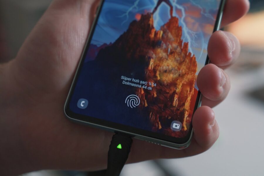 a hand holding a cell phone