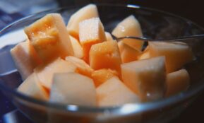 sliced cheese on clear glass bowl
