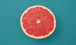 sliced orange fruit on blue background