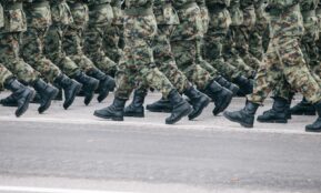 men in green and brown camouflage uniform