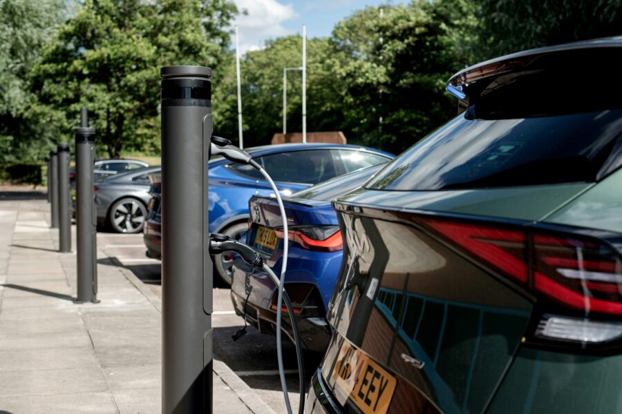 Electric cars are charging at a charging station.