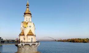 A large body of water with a church on top of it