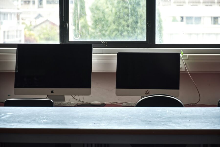 Two computer monitors on a desk