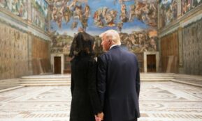 man in black suit standing beside woman in black dress