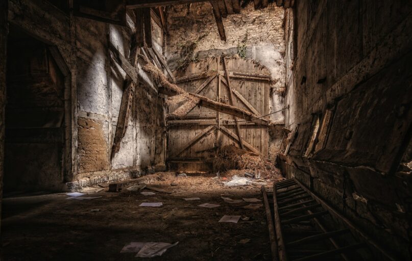 brown wooden door on gray concrete wall