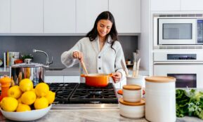 woman cooking inside kitchen room