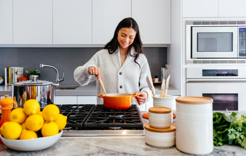 woman cooking inside kitchen room