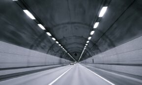 time lapse photography of vehicle under tunnel