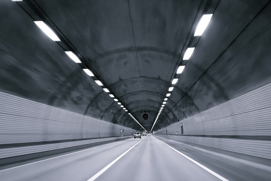 time lapse photography of vehicle under tunnel
