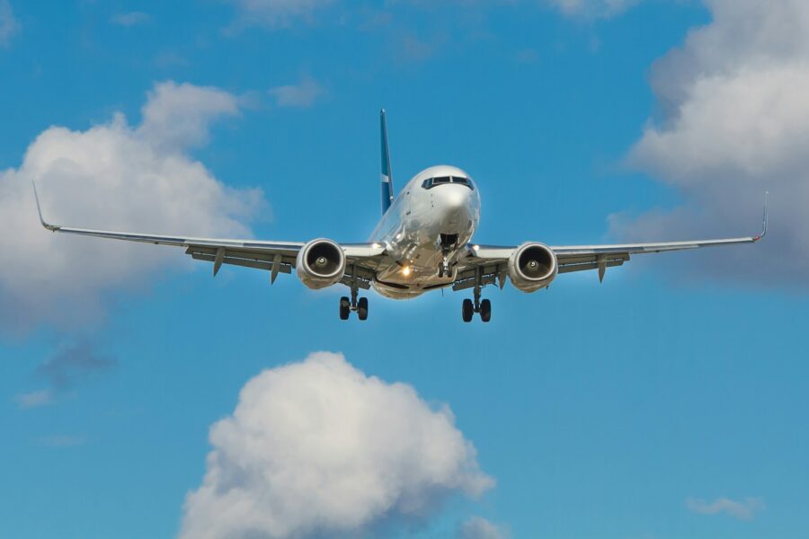 white airplane on mid air