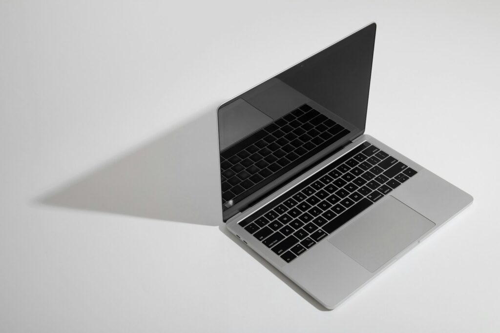 macbook pro on white table