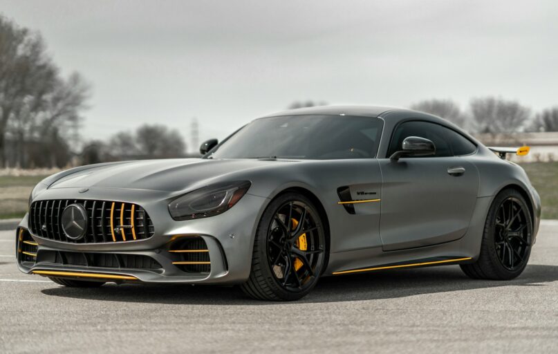 black mercedes benz coupe on gray asphalt road