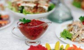 a white table topped with plates of food