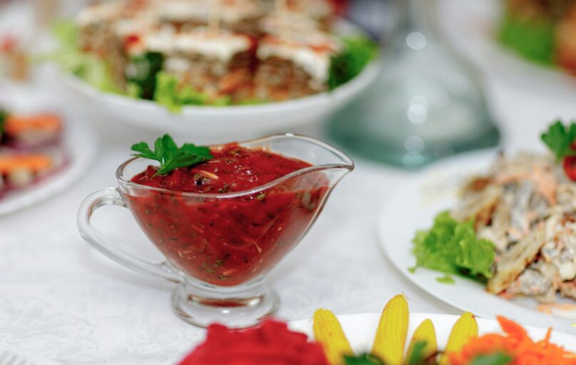 a white table topped with plates of food