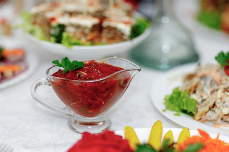 a white table topped with plates of food