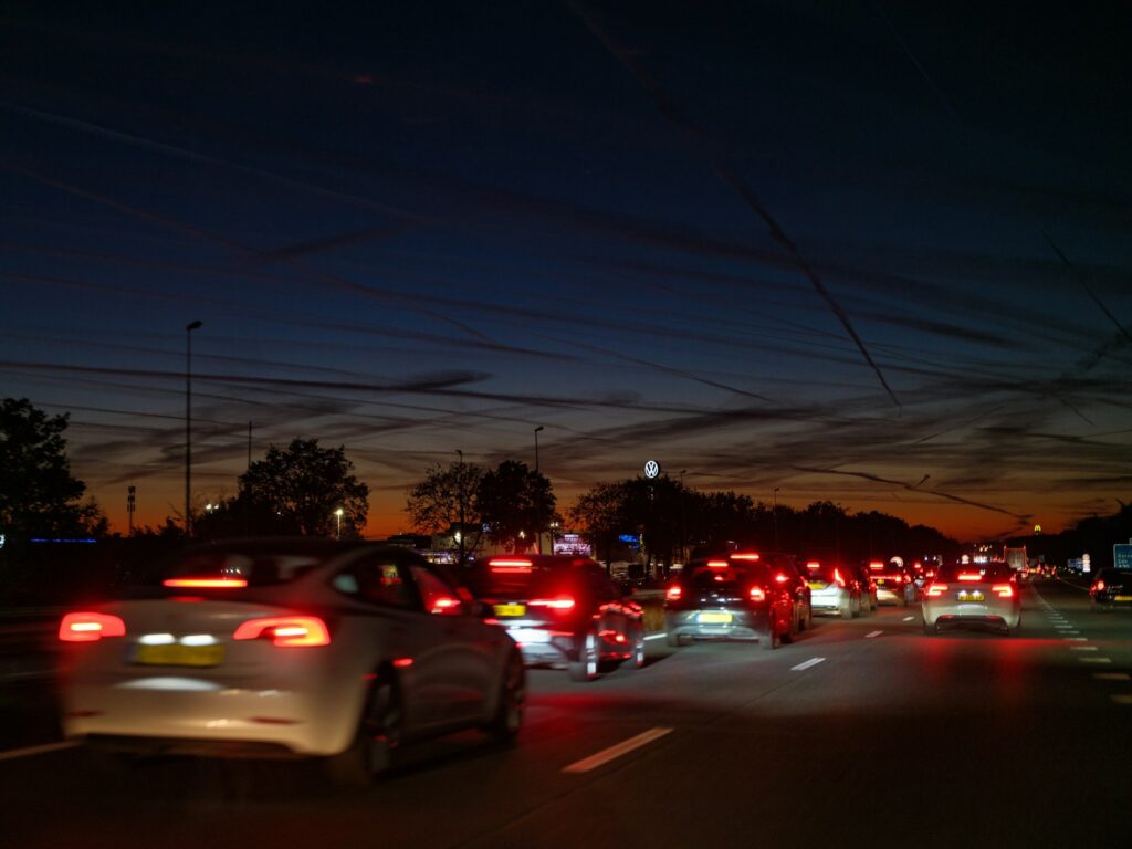 A bunch of cars that are sitting in the street