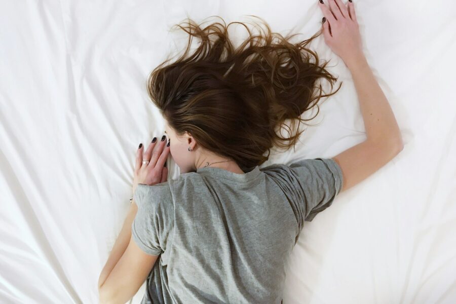 woman laying on bed