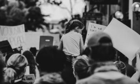 grayscale photo of people walking on street