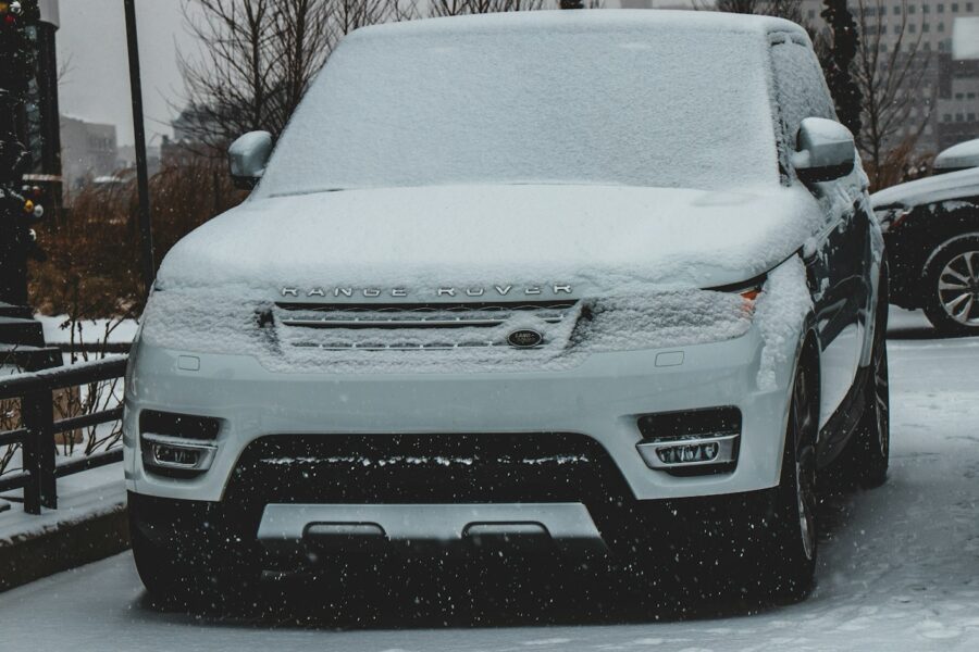 snow covered Land Rover Range Rover SUV