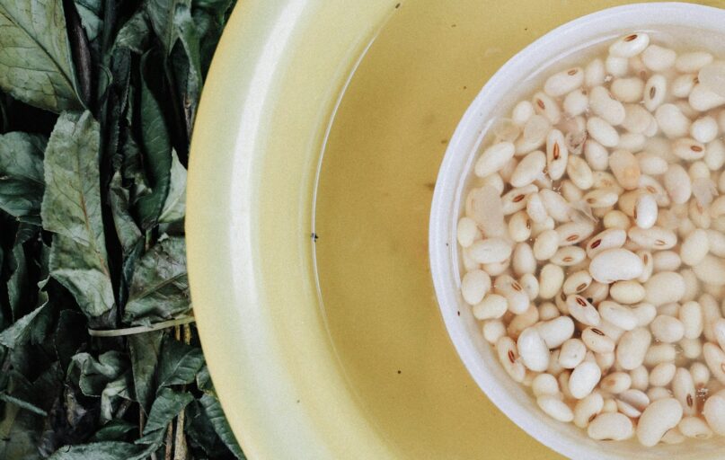 white beans in yellow bowl