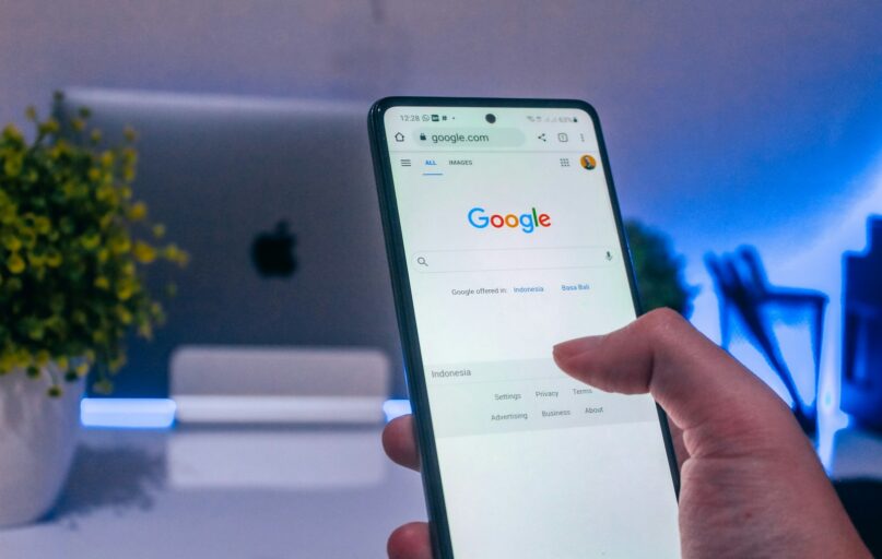 person holding white android smartphone