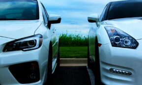white Nissan GT-R and white Mitsubishi Lancer Evolution 10
