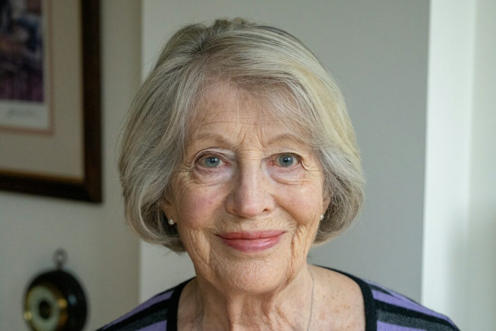 an older woman with a smile on her face