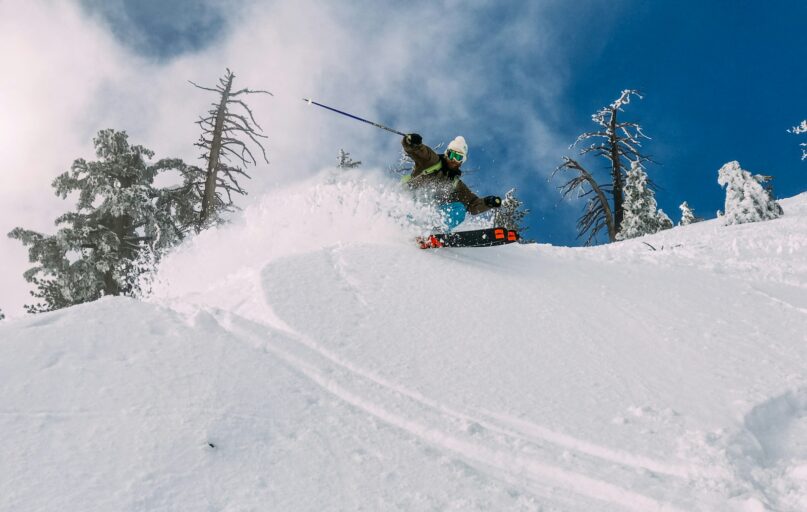 person skiing on snow-covered hill