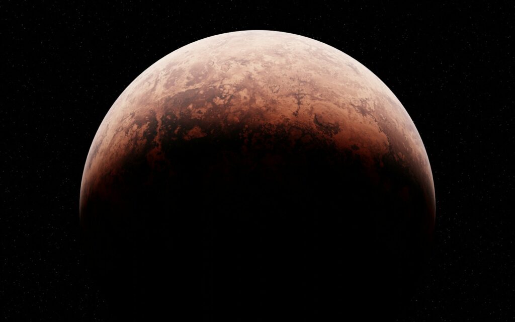 A close up of a red moon in the sky