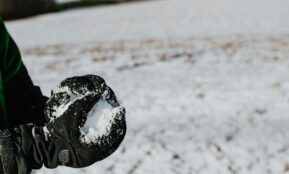 black heart shaped ornament on white sand
