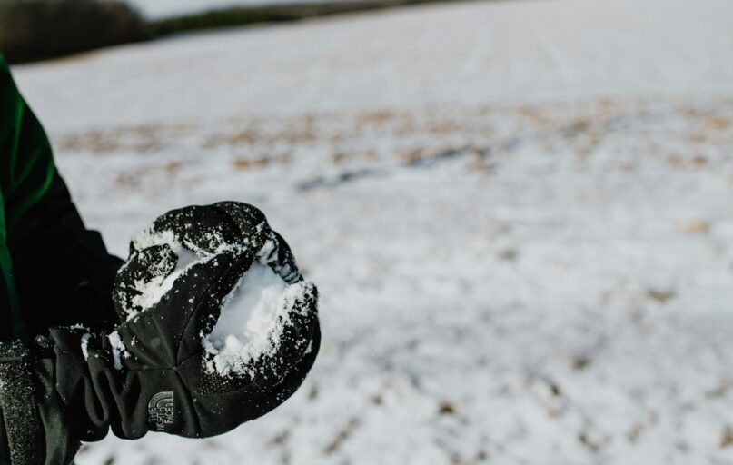black heart shaped ornament on white sand