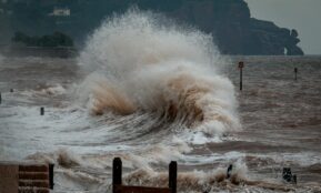 sea waves crashing on shore during daytime