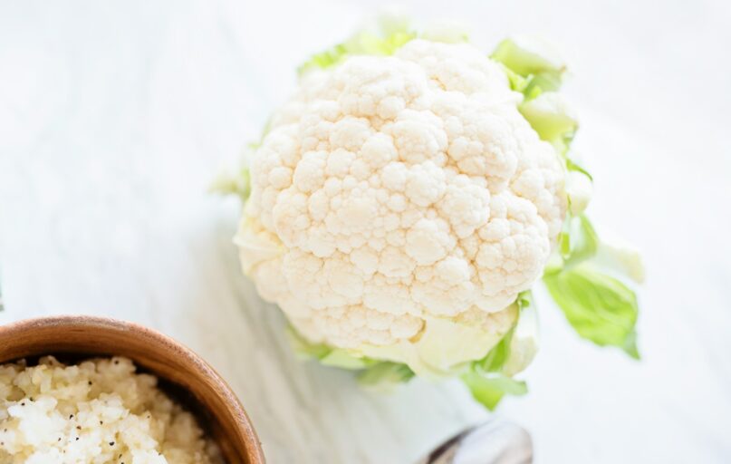 white flower on brown wooden round pot
