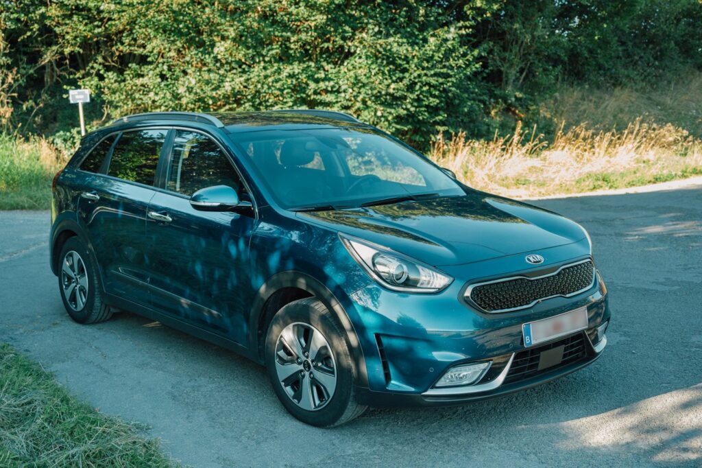 blue bmw m 3 coupe parked on gray concrete pavement during daytime