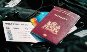 a passport and a boarding pass are on a bag
