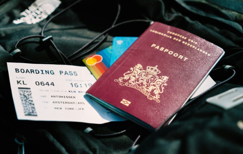 a passport and a boarding pass are on a bag