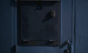 A closed metal door with a lock