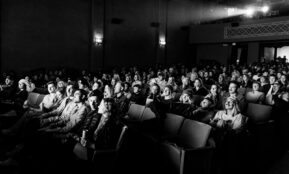 a black and white photo of a crowd of people