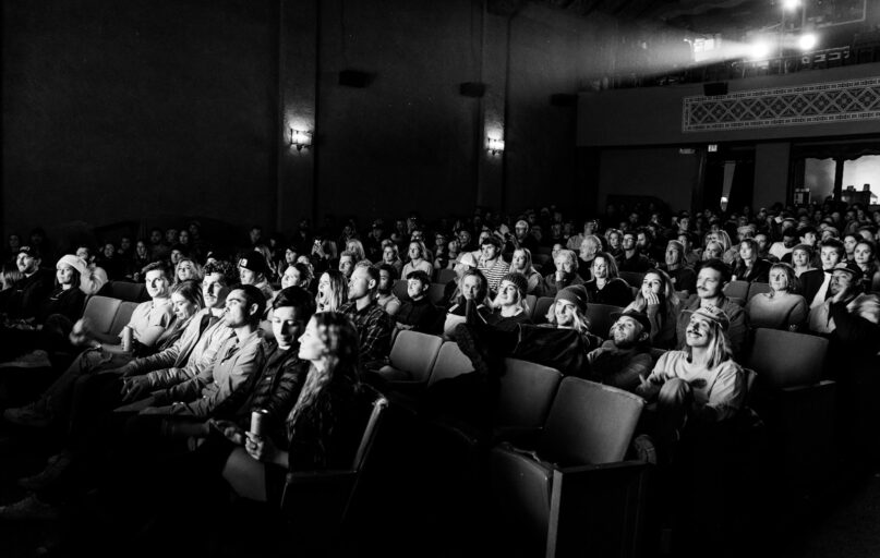 a black and white photo of a crowd of people