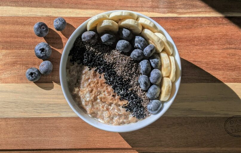 brown and black beans in white ceramic bowl