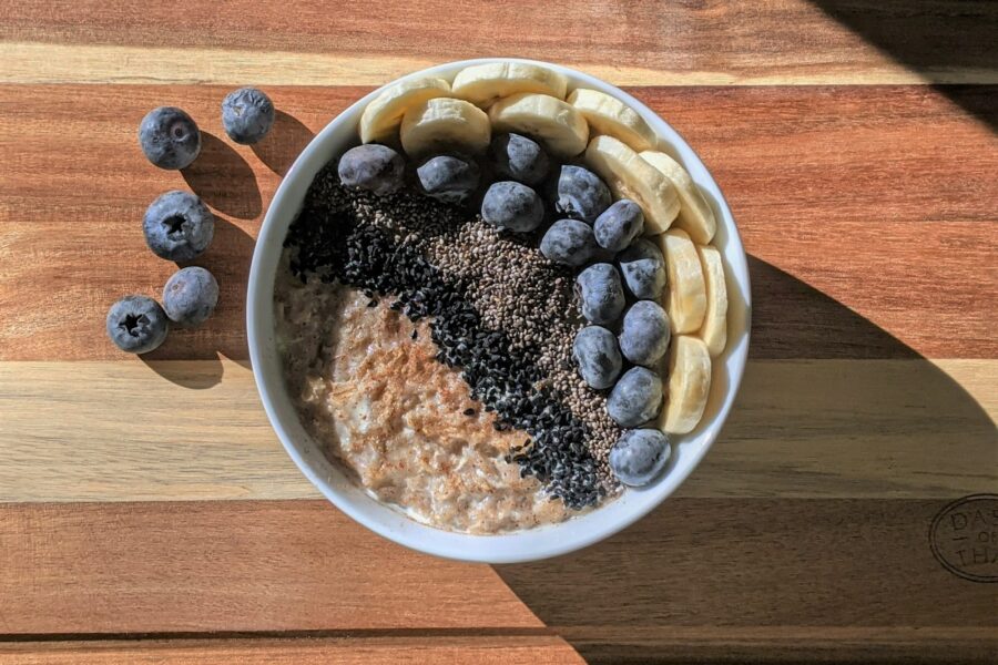 brown and black beans in white ceramic bowl