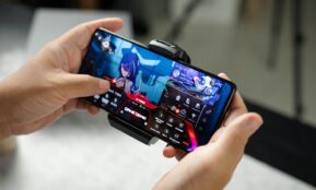 A person holding a cell phone in their hand