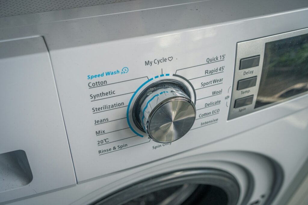 a close up of a washing machine with buttons