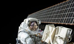photography of Astronaut beside satellite