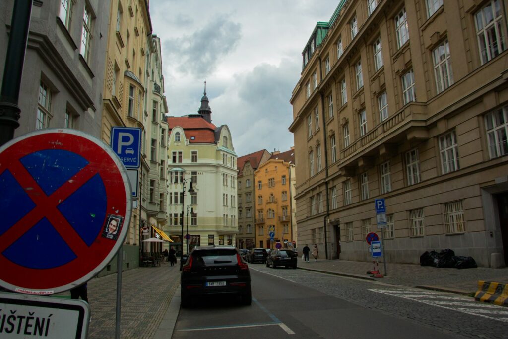 Street scene with buildings and a no parking sign.