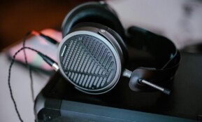 Close-up of professional headphones on a desk, featuring intricate design and modern audio technology.