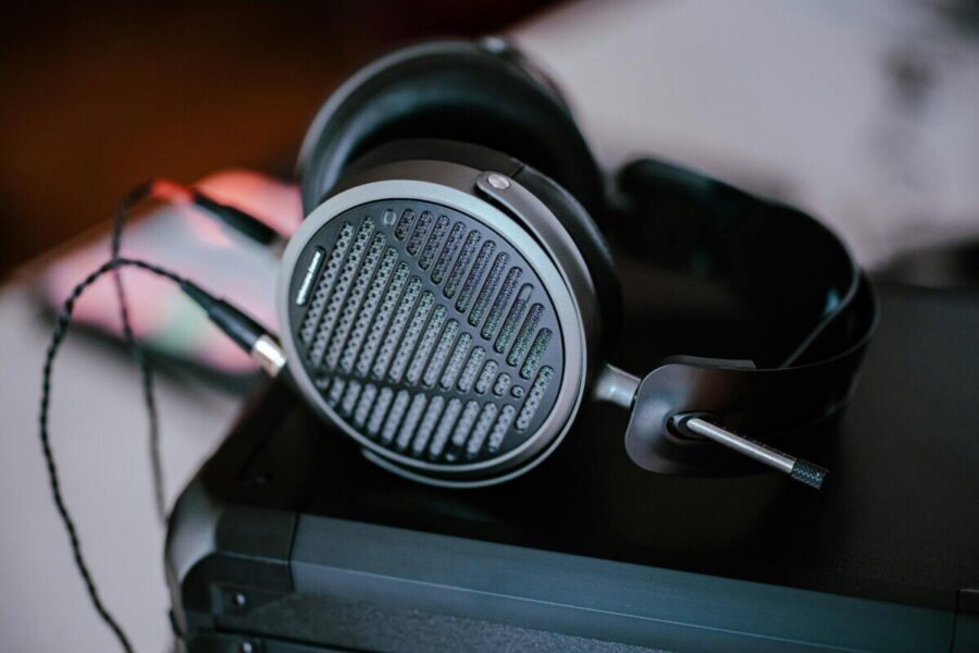 Close-up of professional headphones on a desk, featuring intricate design and modern audio technology.