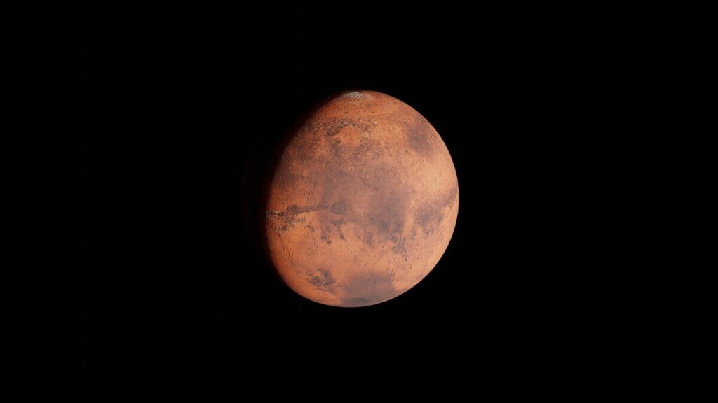 Detailed view of Mars showcasing its surface features against a dark sky backdrop.